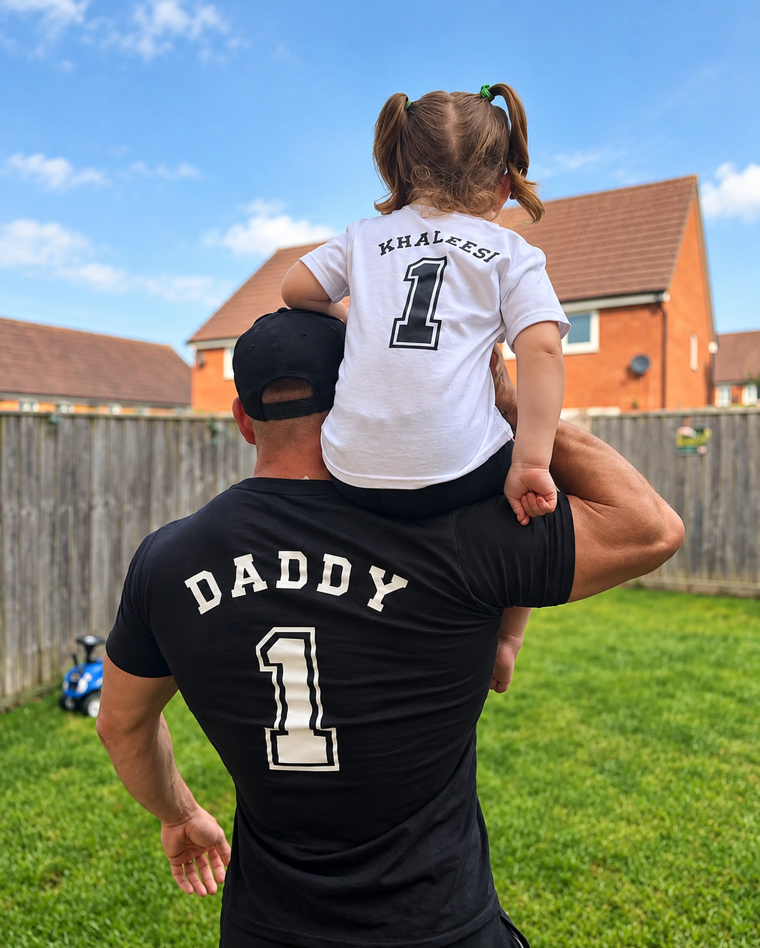 Daniel carrying his daughter Khaleesi